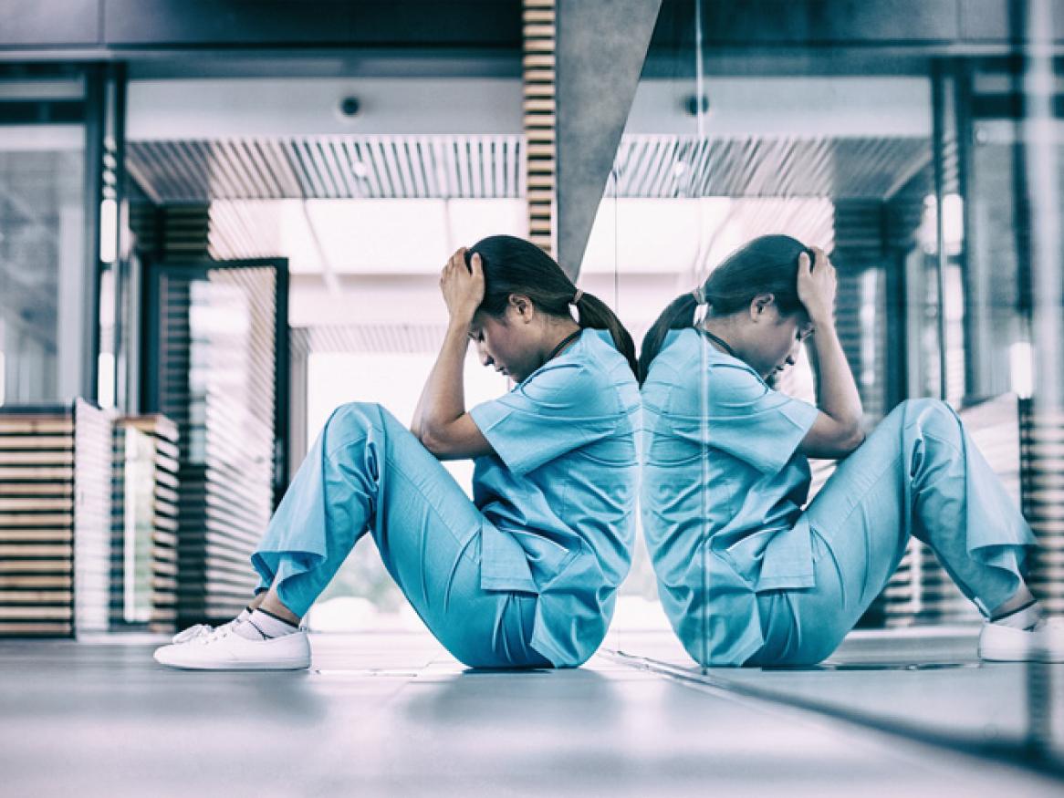 Nurse sitting on ground