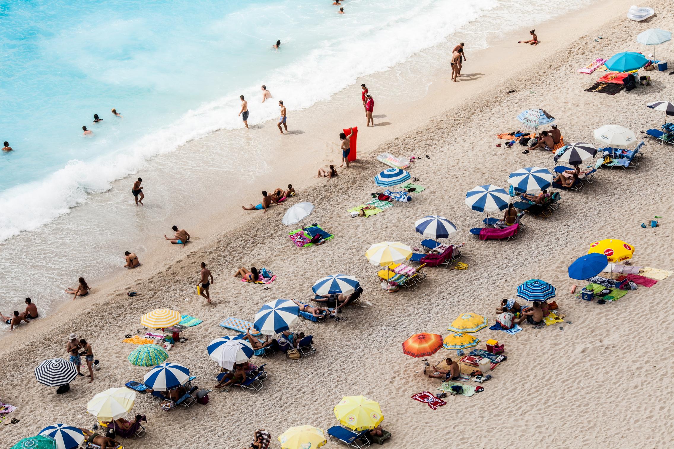 people relaxing on the beach