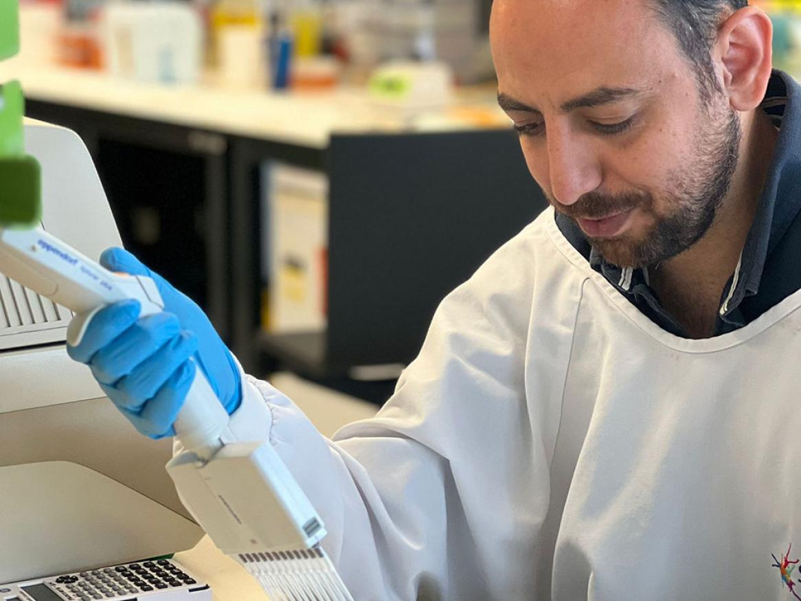 Cancer researcher testing cells using state-of-the-art equipment