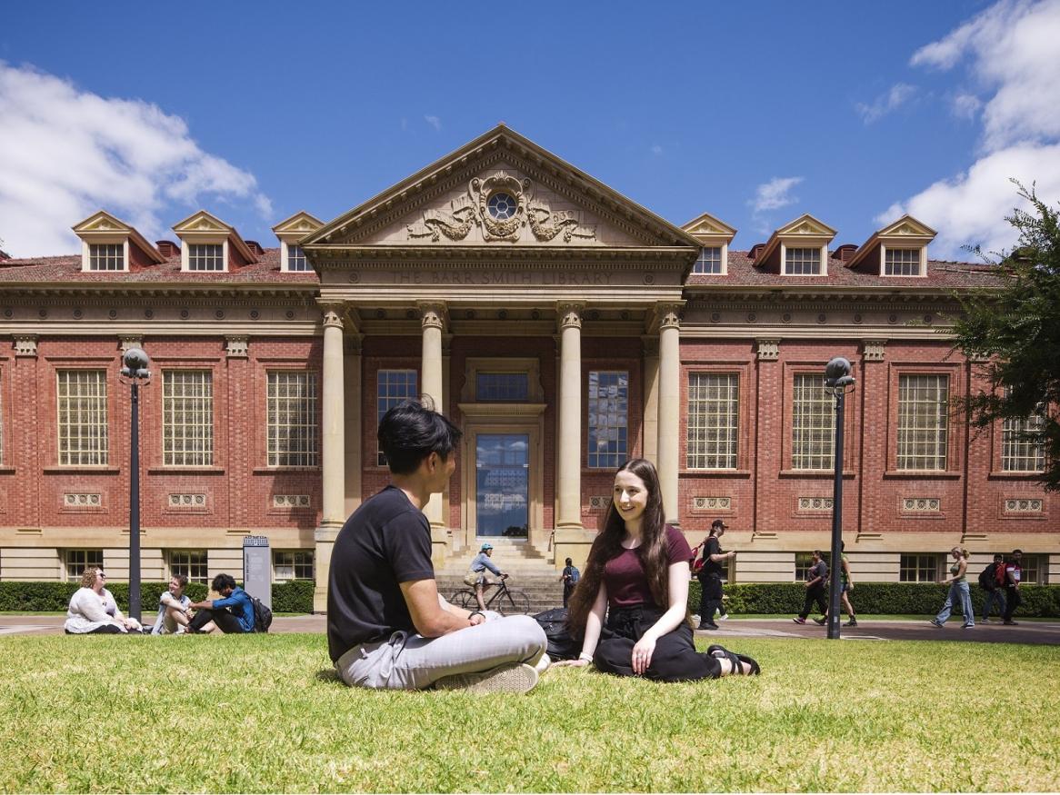 students in front of library