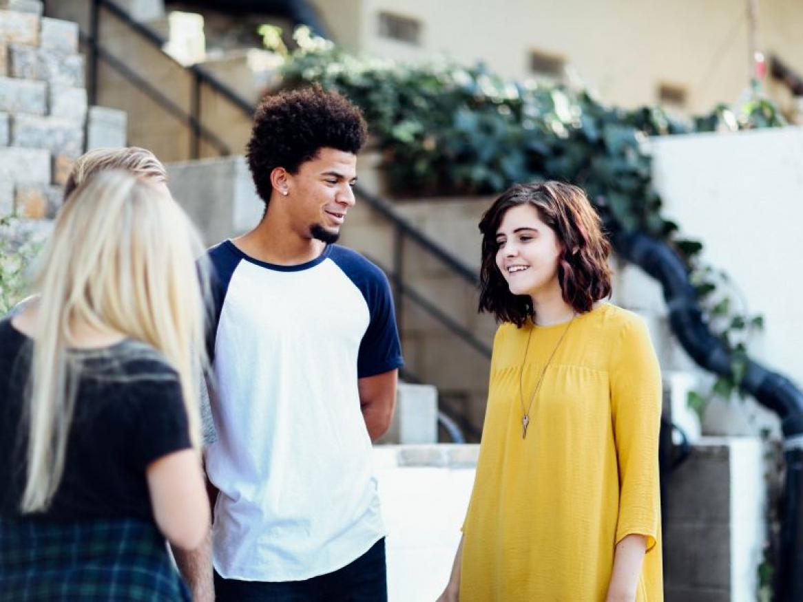 three people talking