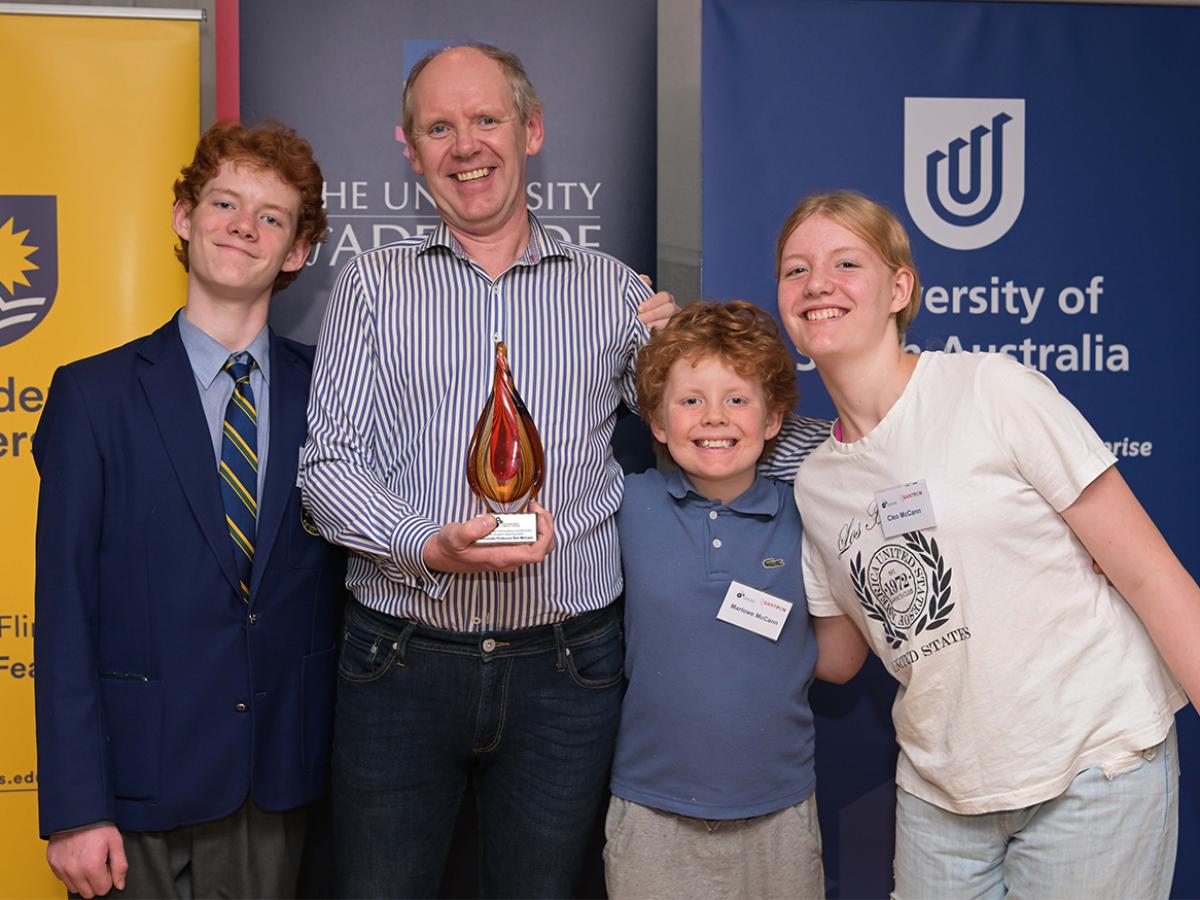 Ben with family accepting award