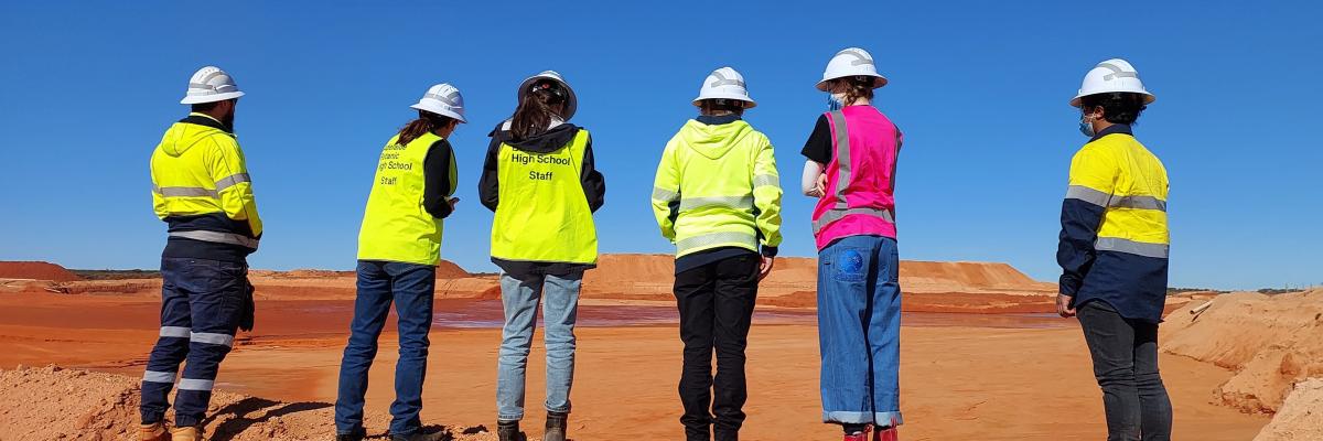 A group of high school students at a mine site visit