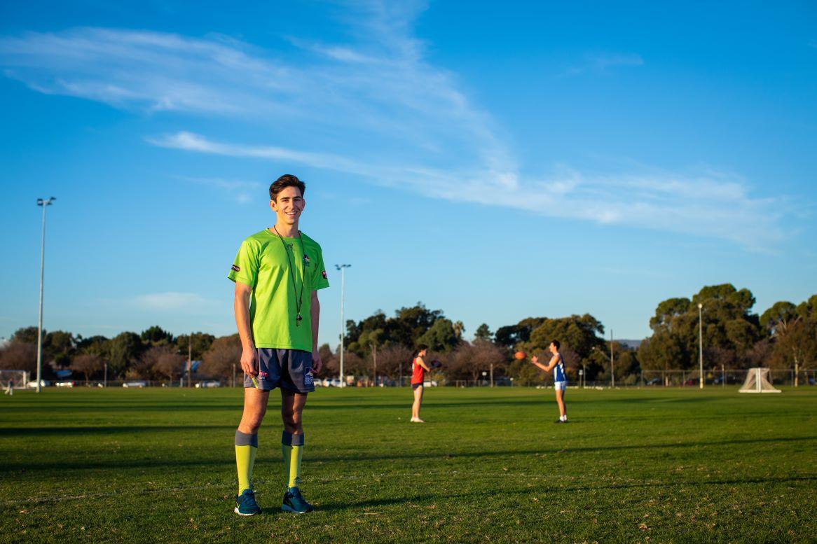 A man working as an umpire at a football game.