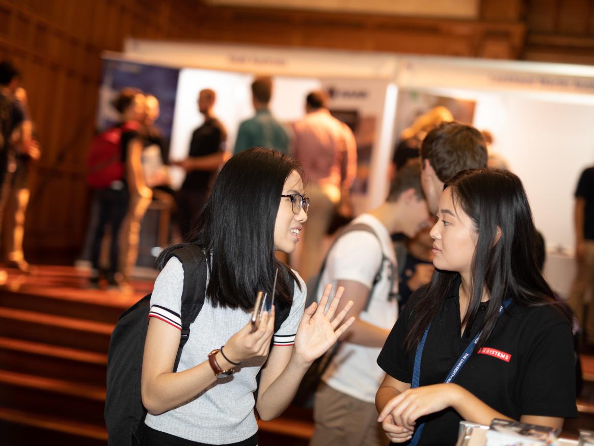 Student talking to employer at previous expo