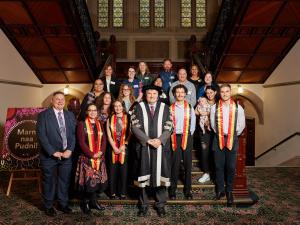 First Nations Graduates with guests and UoA Provost Professor John Williams AM