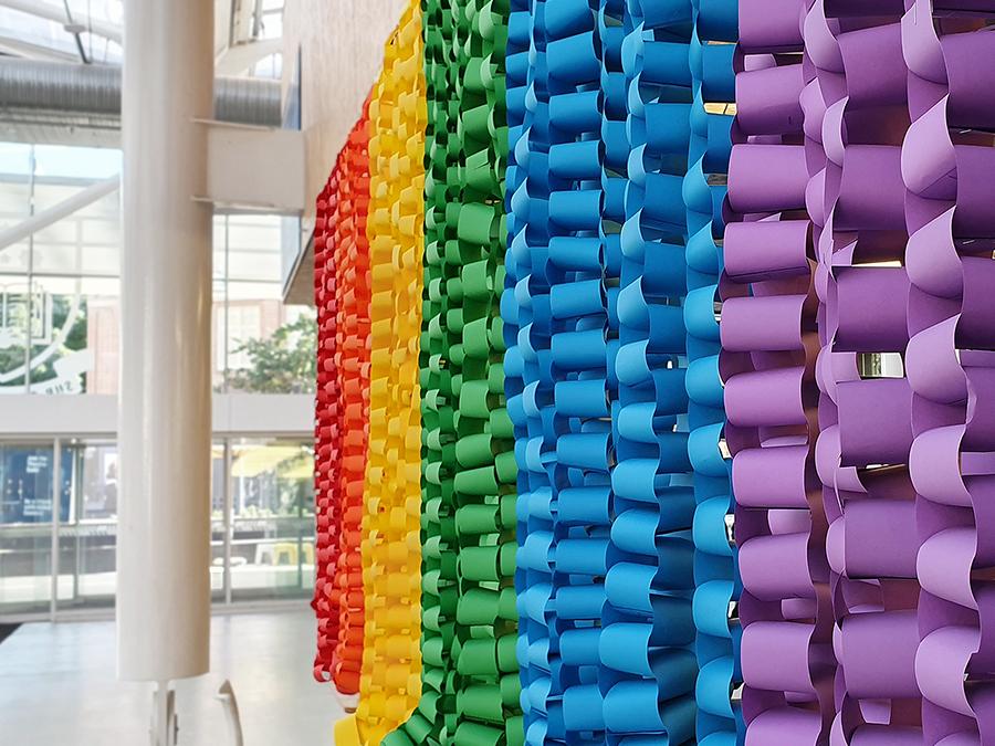 Close up of rainbow coloured chain links hanging in Hub Central