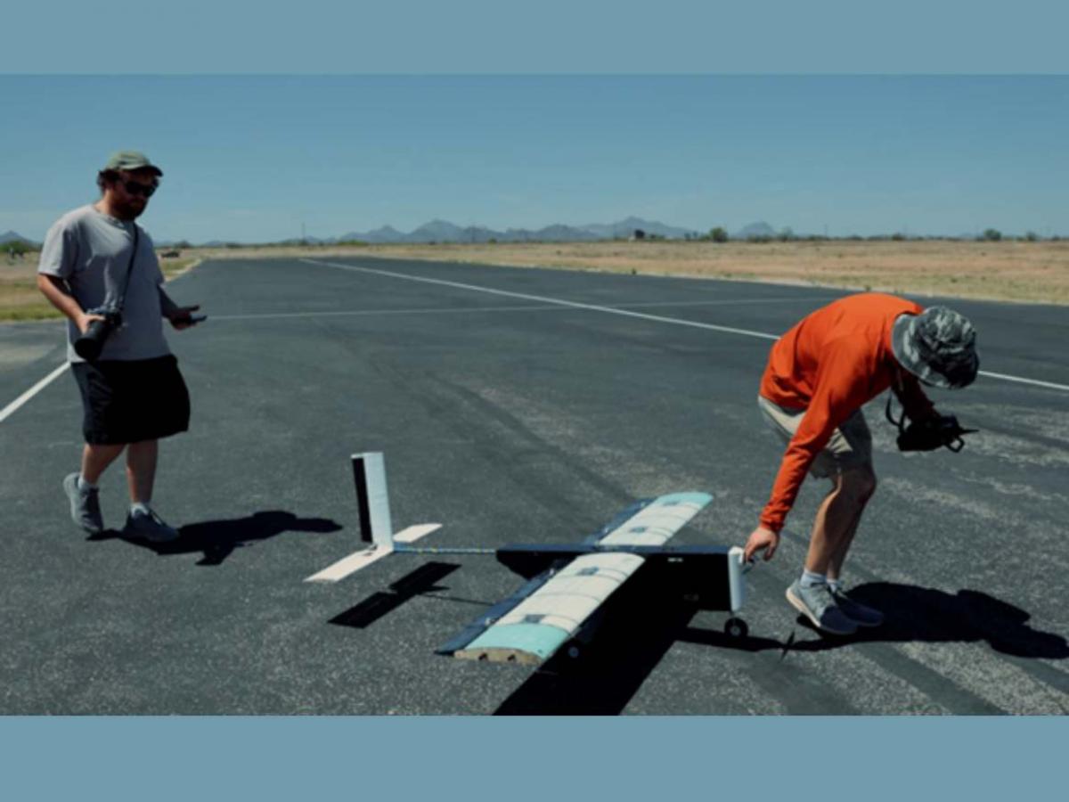 Greg and Harry with remote-controlled airplane