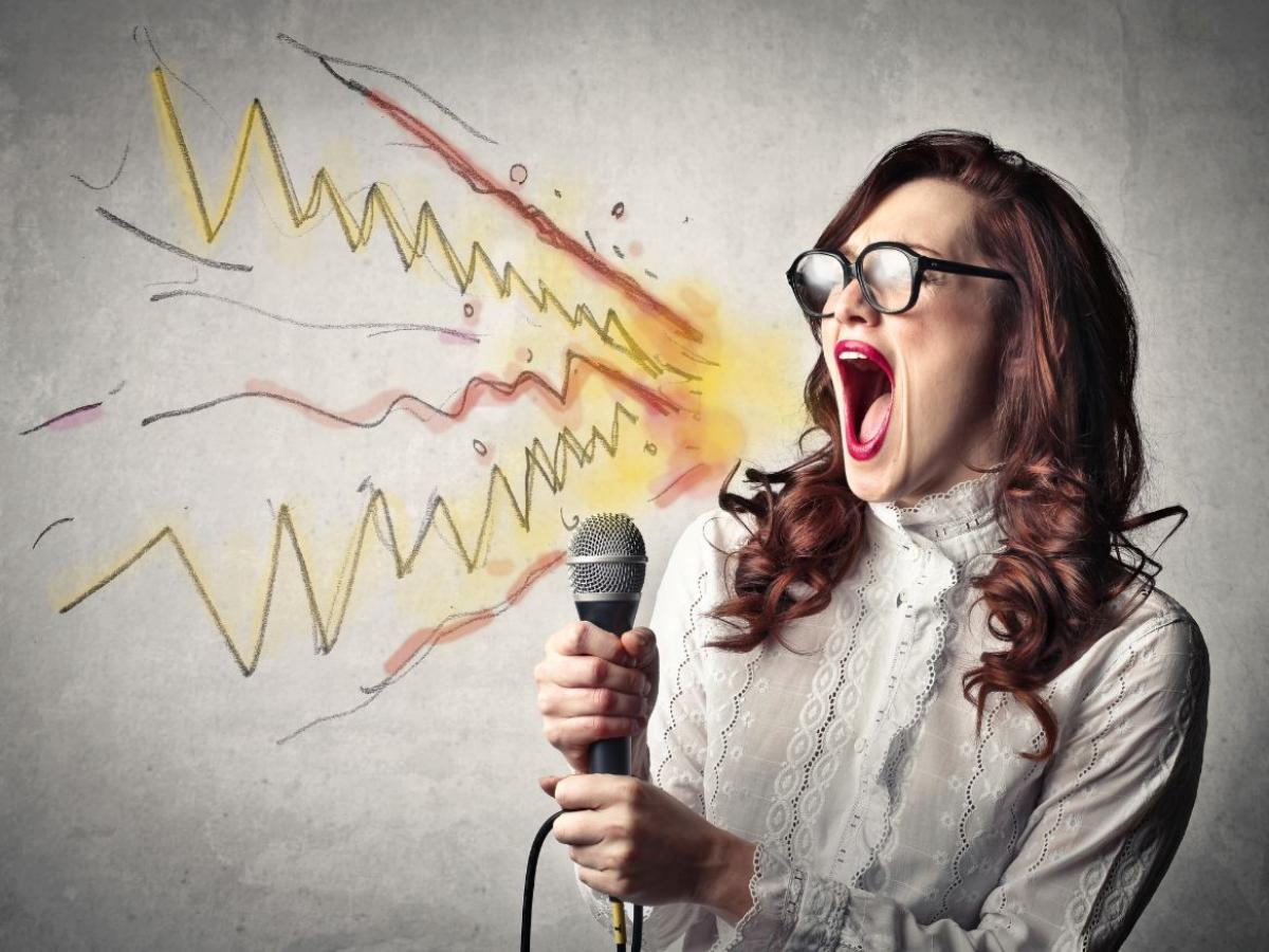 lady shouting into microphone