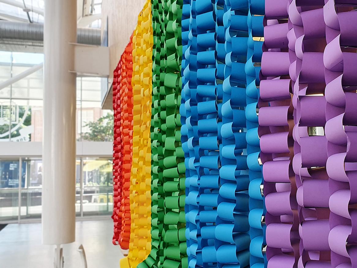 Close up of rainbow coloured chain links hanging in Hub Central