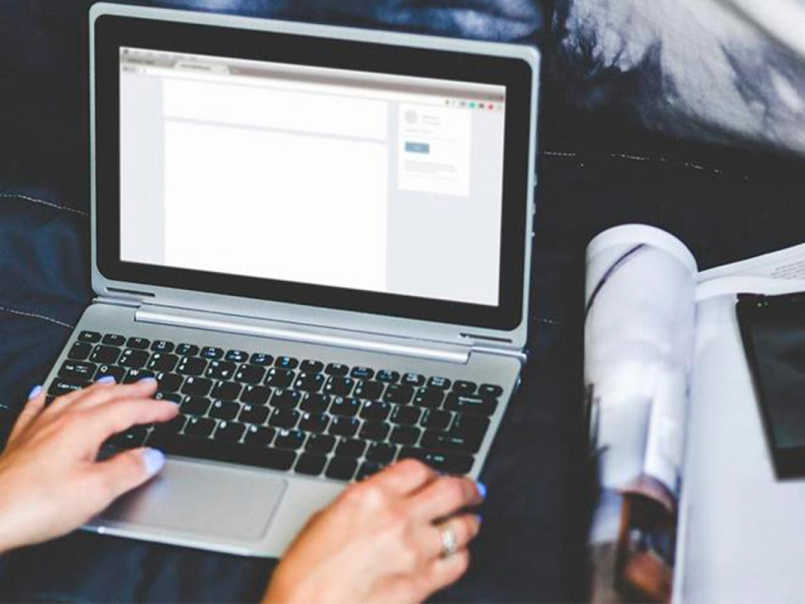 Person using a word processor on laptop