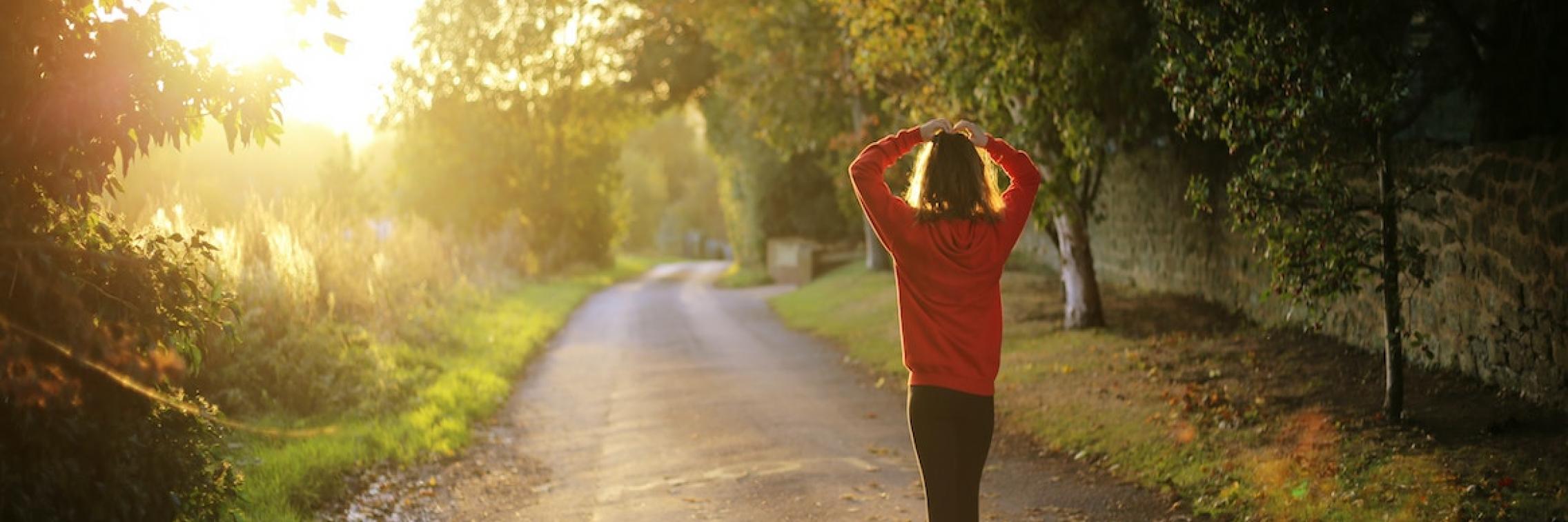 Woman walking in a park.