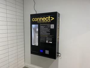 CONNECT machine attached to bathroom wall, All Gender bathroom, Barr Smith South Level 2