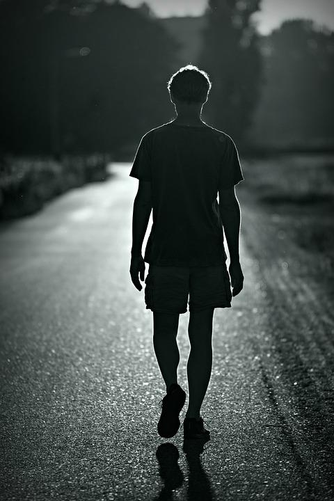 a person walking alone along a road