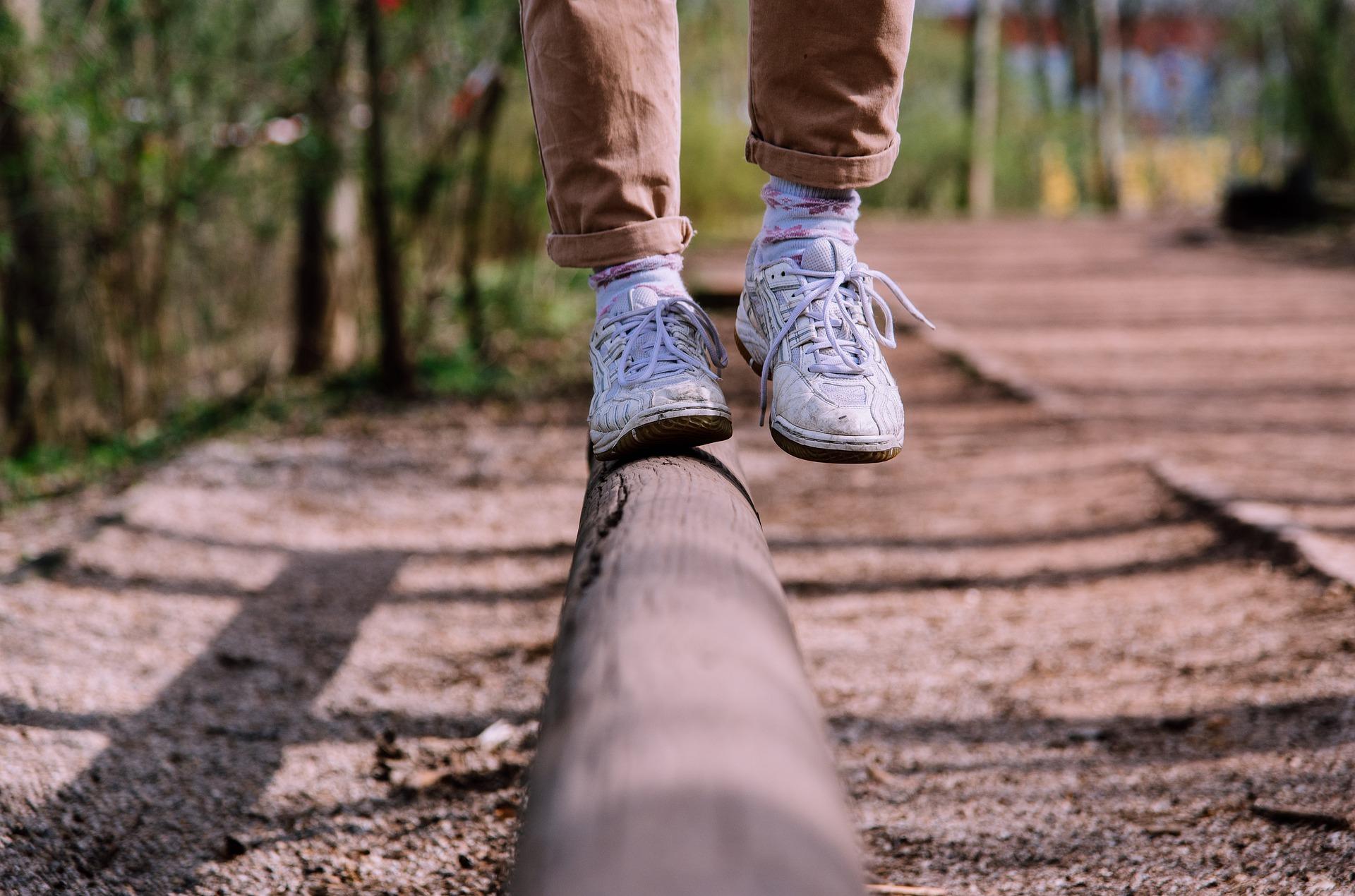 Person balancing on a log