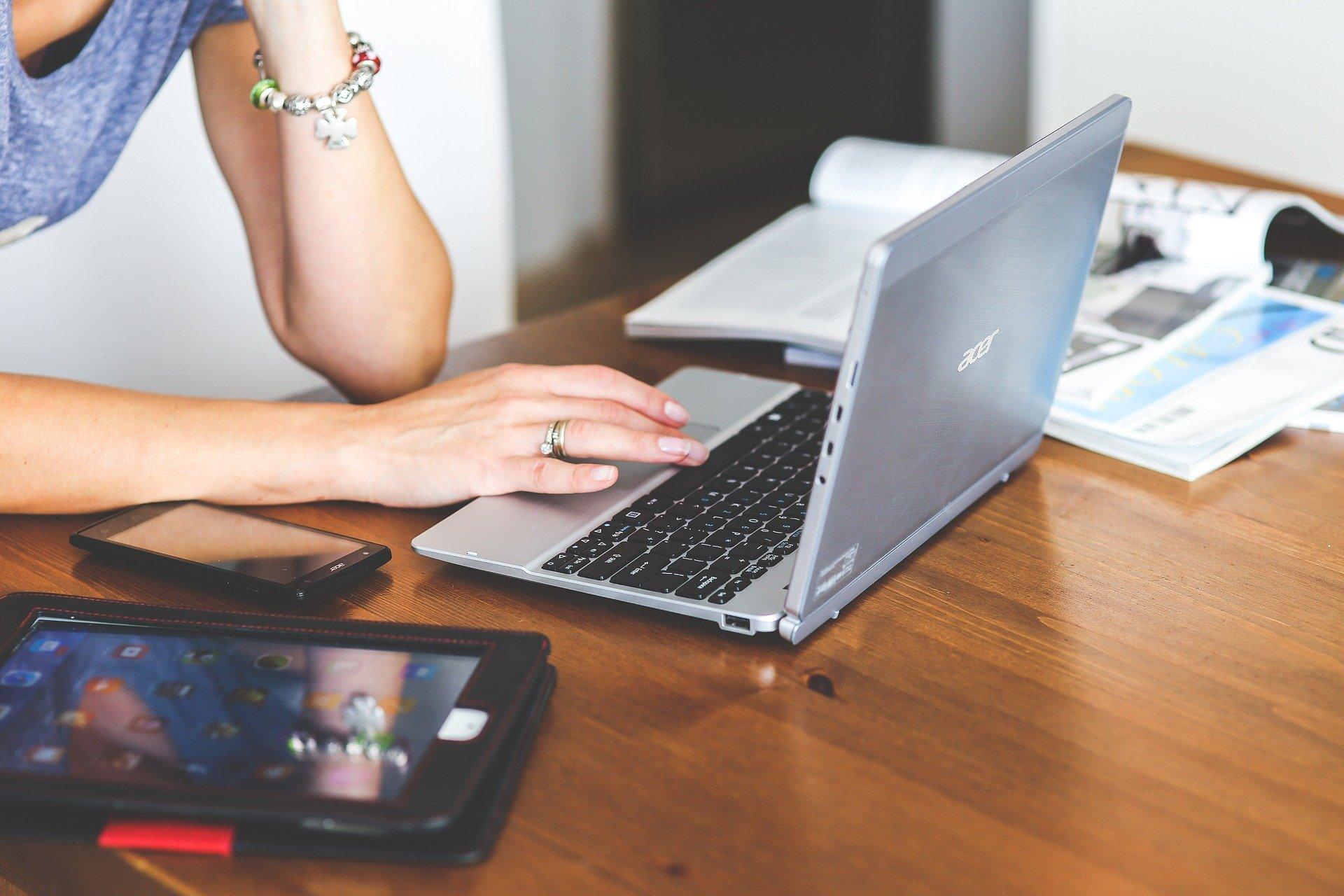 Woman typing on laptop