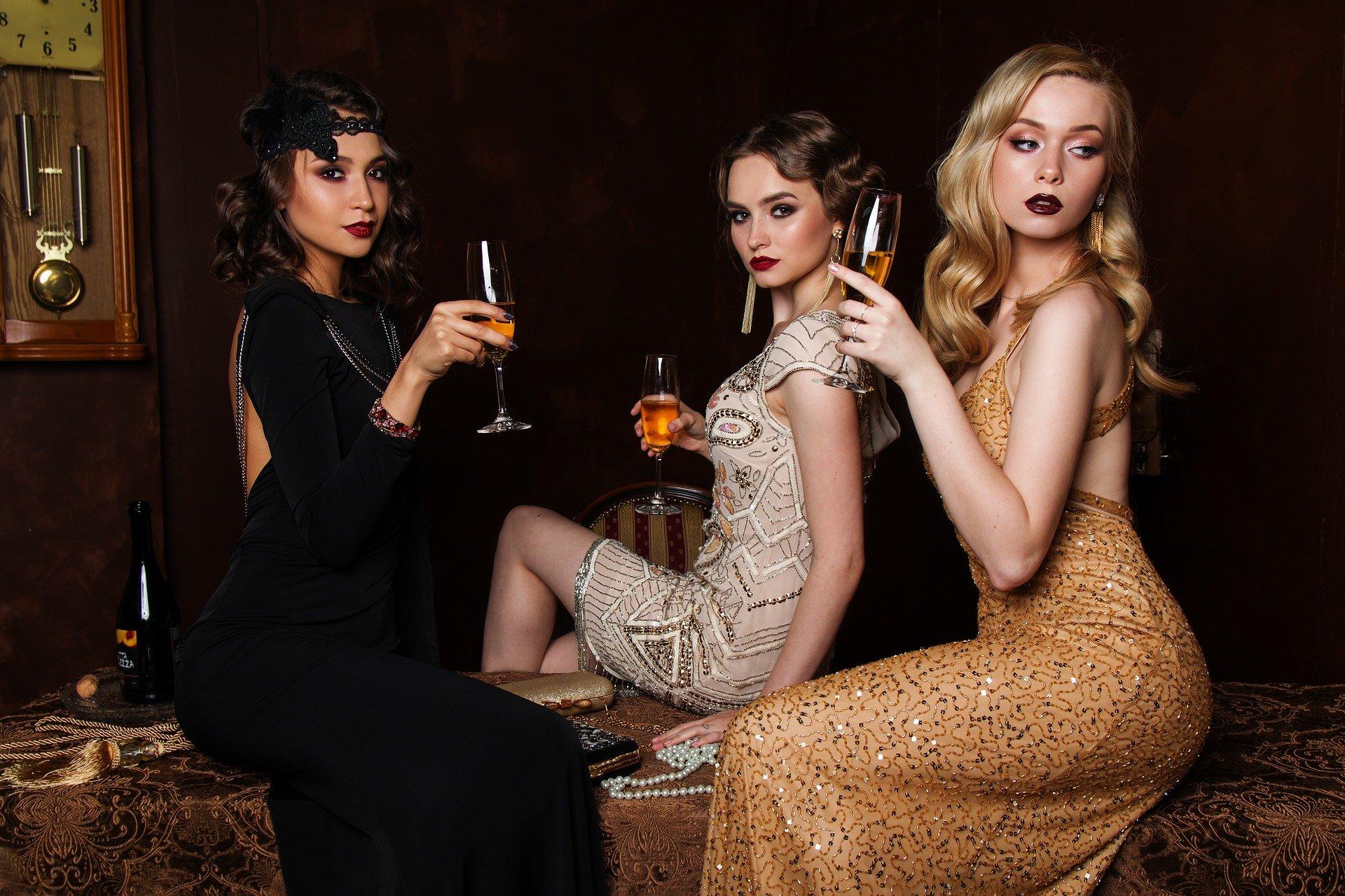 3 women in ball dresses