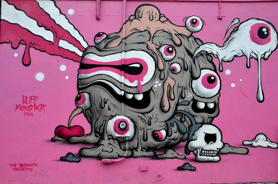 graffiti art of a monster in a pink backdrop