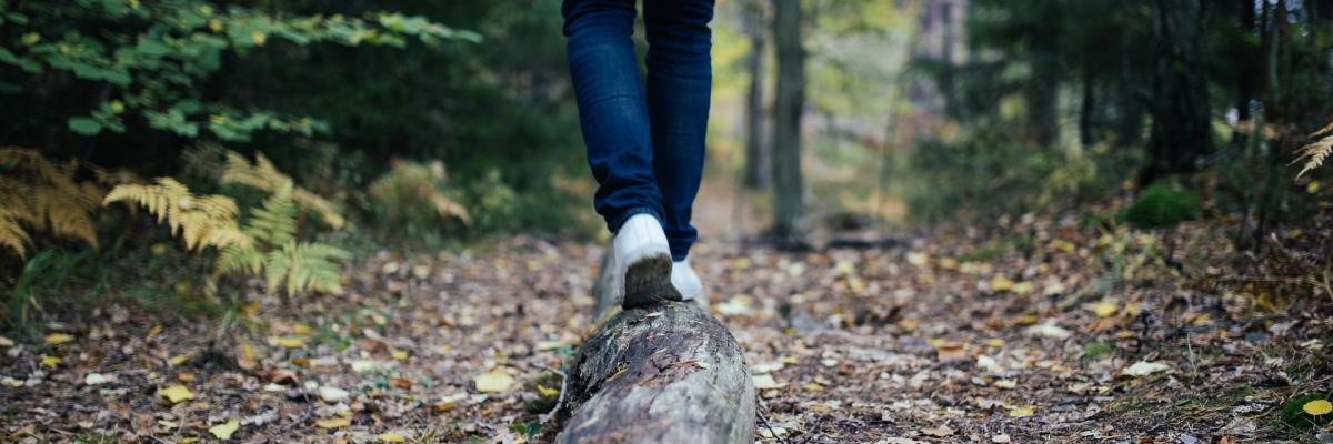 Man walking on log