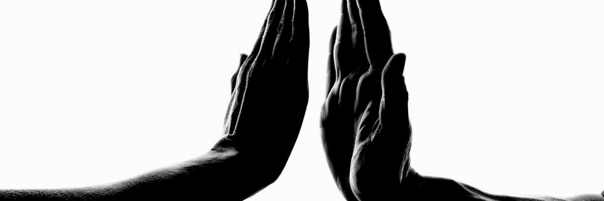 Hands almost touching.