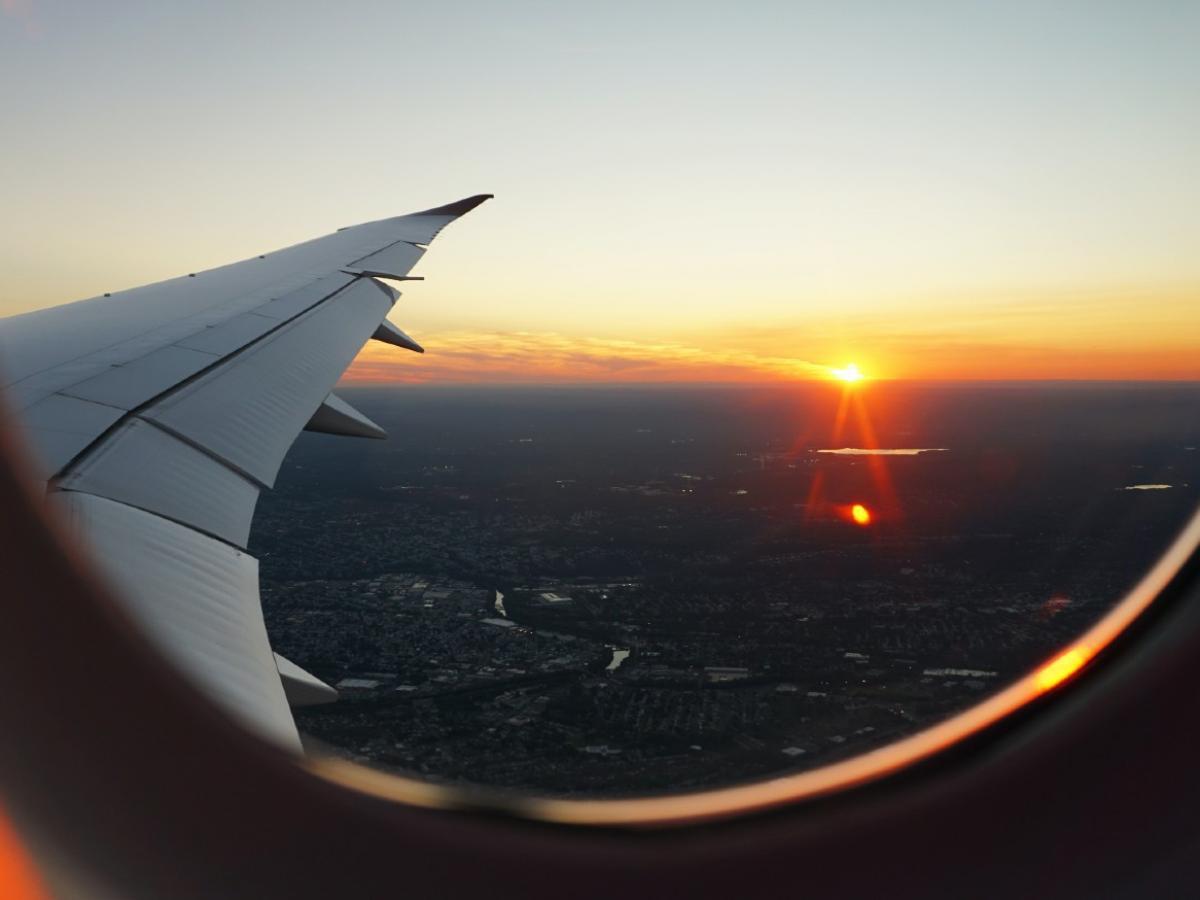 Airplanes window view of sky by Eva Darron