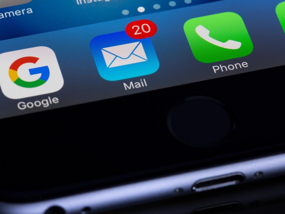 screen of an iphone showing twenty unread emails