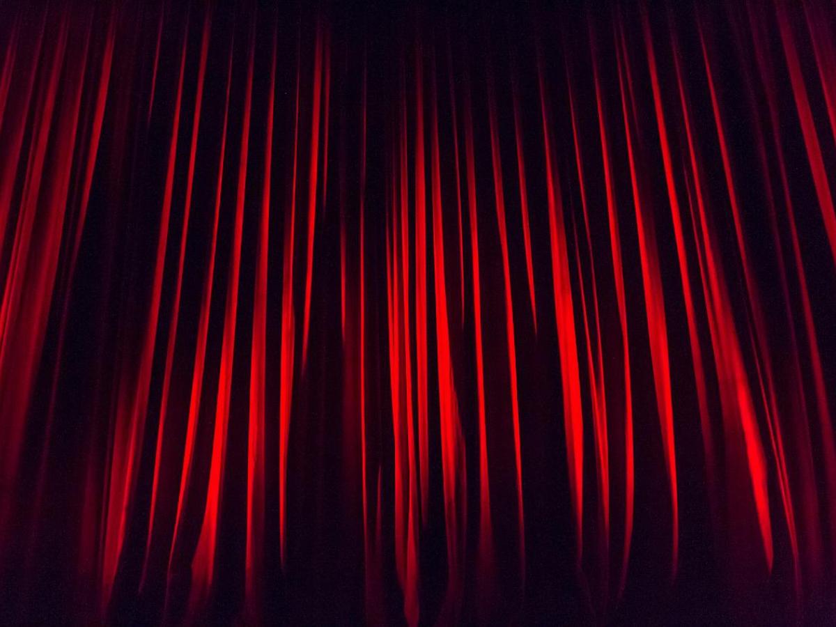 A red stage curtain. 