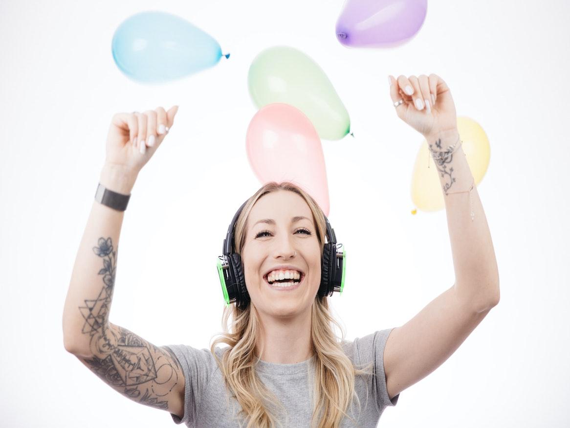 Woman listening to music with headphones on.