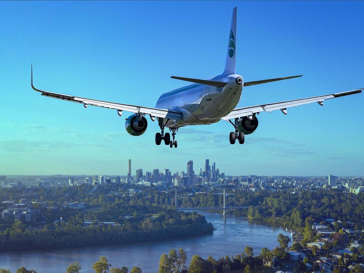 A plane flying over a city