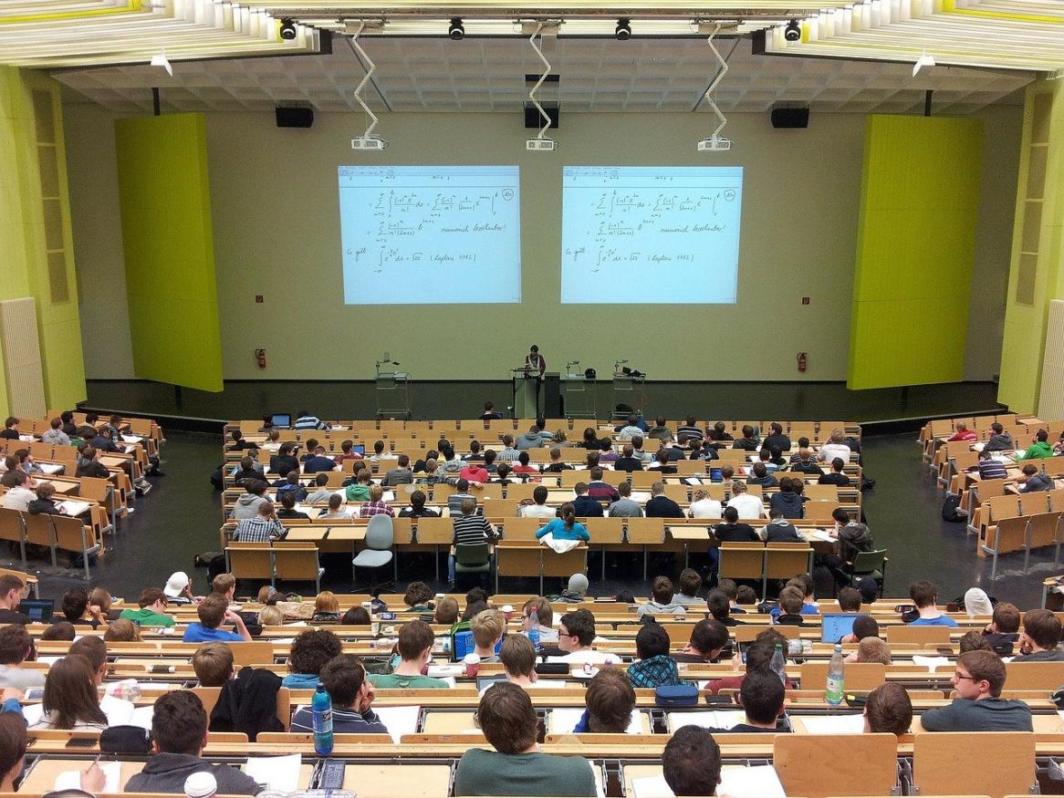 A university lecture room filled with students.