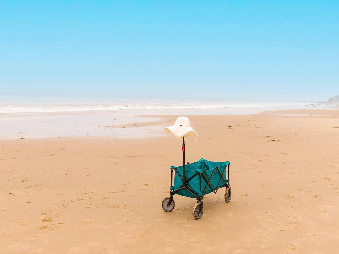 hat and wagon on beach