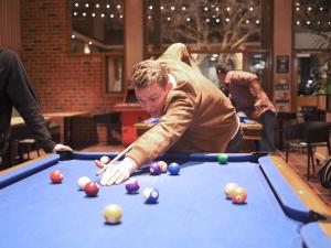 BR student playing pool