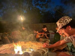 Aaron enjoying Texan BBQ and Campfire (2024)