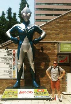 Posing with an Ultraman statue in Tokyo