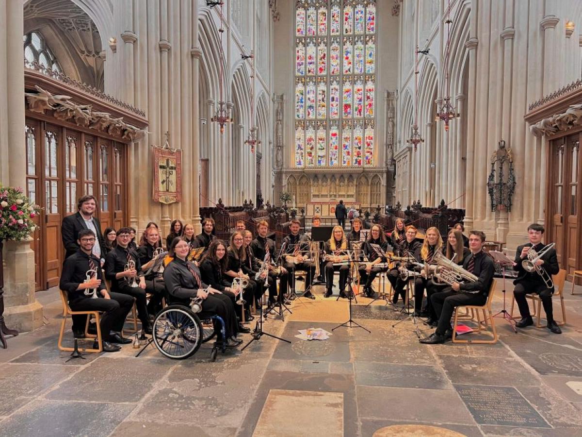 Alexander representing Cardiff University Brass Band performing at Bath Abbey (2023)