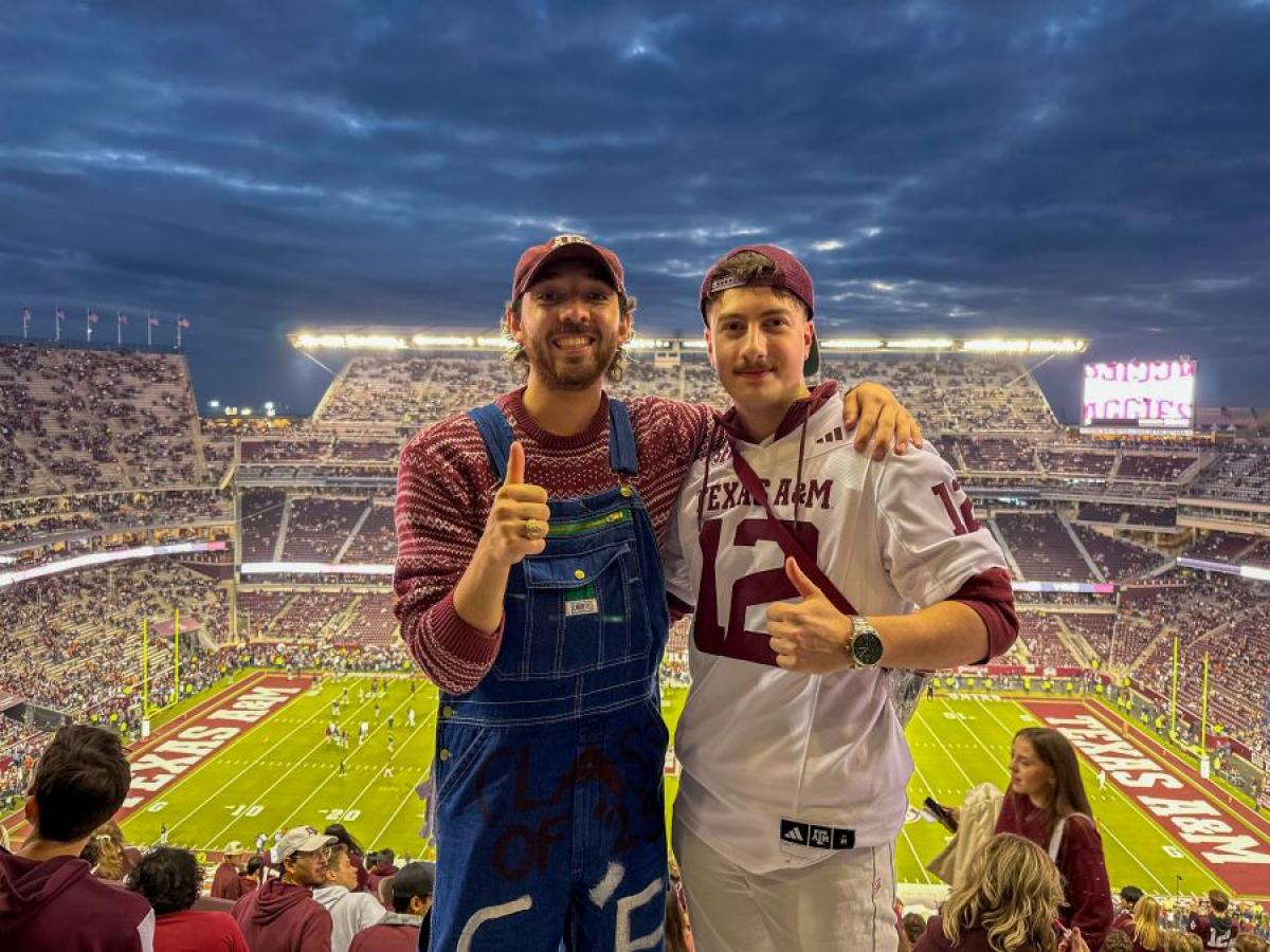 Aaron with a friend watching College Football (2024)