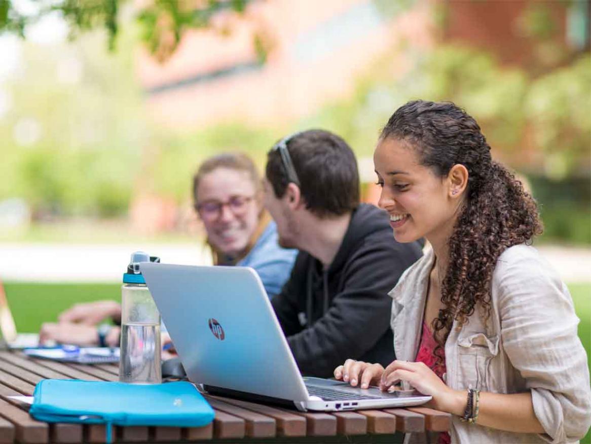 Students studying on campus at the Maths Lawns