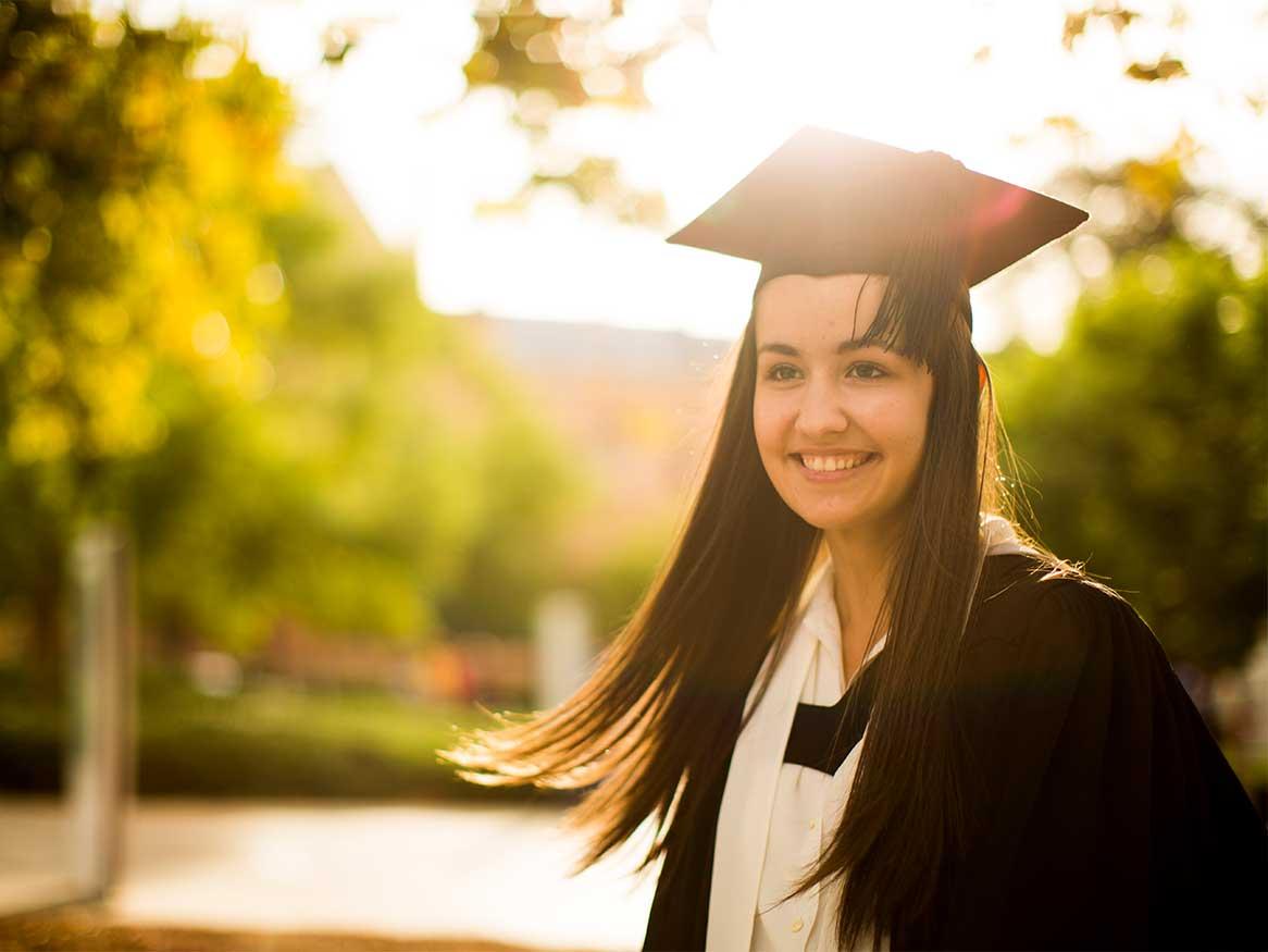 Student in graduation cap and gown