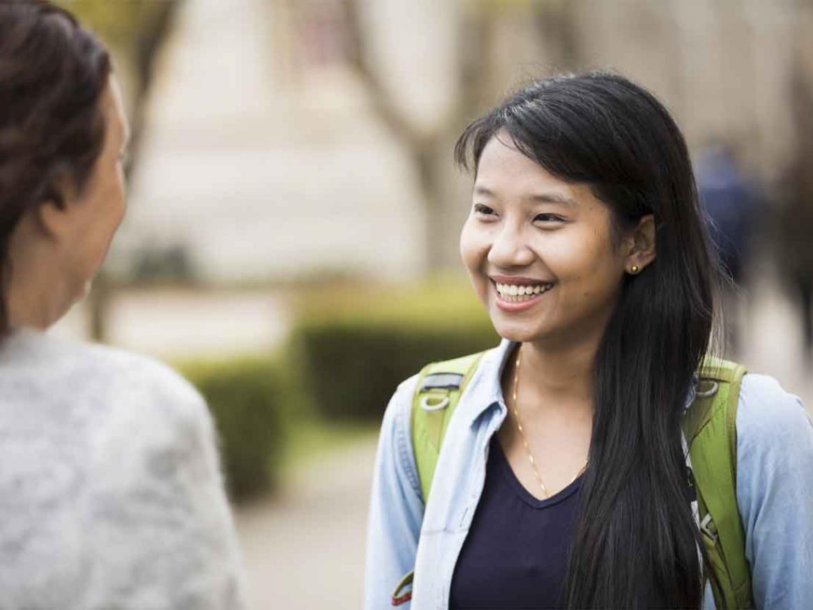 An international student socialising on campus