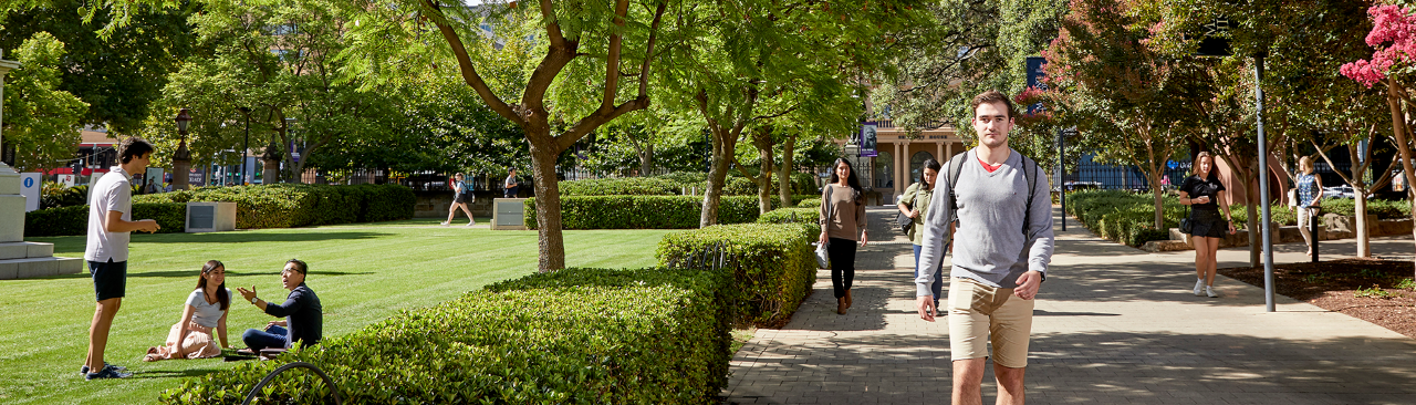 Students walking along Goodman Crescent on campus