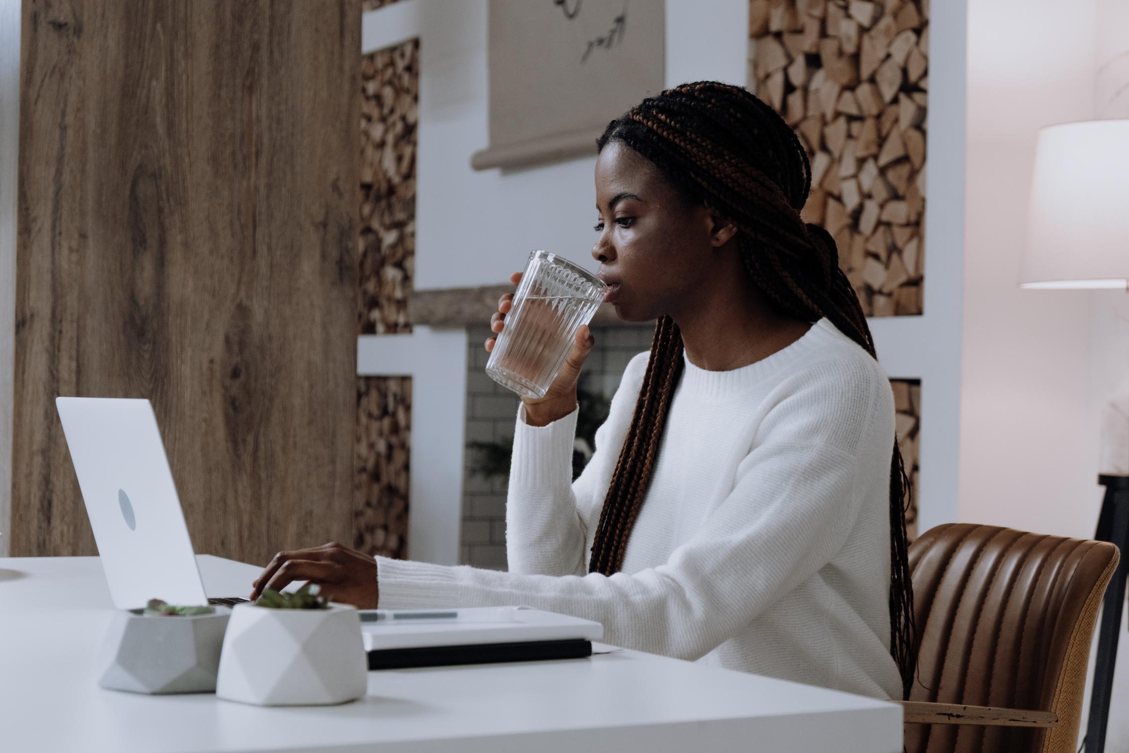 Picture of a woman using a laptop at home