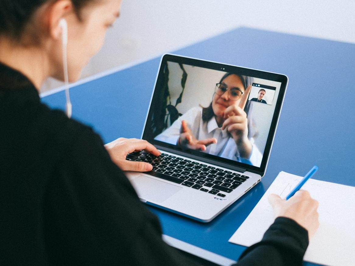 Woman videoconferencing on laptop