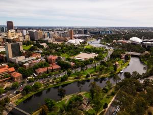 An aerial view of the western side of the University showing the University footbridge, River Torrens and in the distance the Adelaide Festival Centre, Adelaide Entertainment Centre and Adelaide Oval can be seen. All within a 10-15 minute walk.