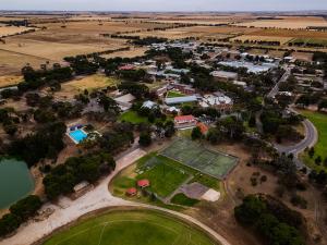 Roseworthy campus aerial photo showing the swimming pool, tennis courts, soccer and football fields and buildings on campus.