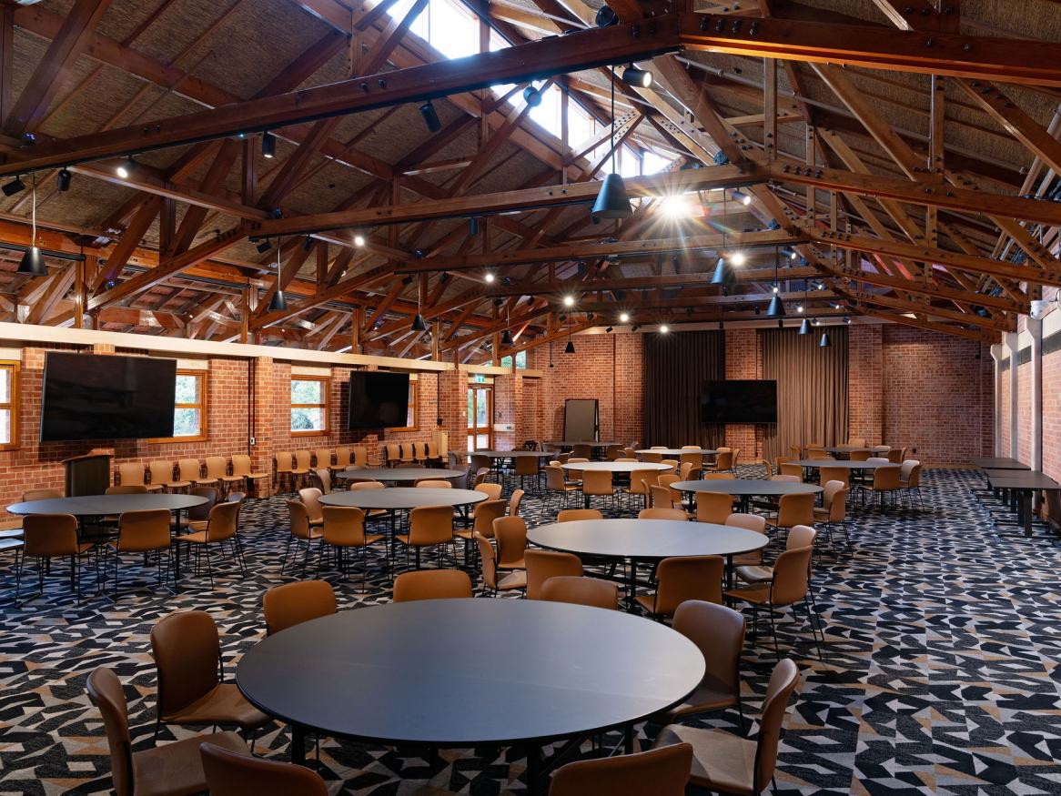 Function room with vaulted ceiling and banquet furniture