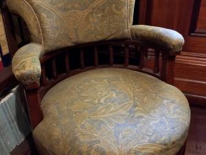 Original library tub chair covered with fabric designed by Aldam Heaton.