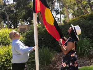 Waite campus flag raising